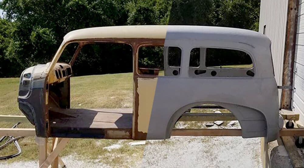 A car body is sitting on a wooden stand